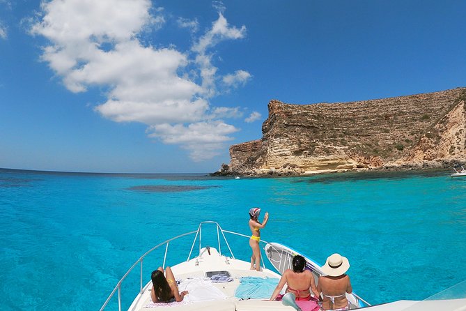 7 hours Boat trip to Lampedusa lunch, SUP and Snorkeling - Marine reserve beach views, then a possible swim to the shore