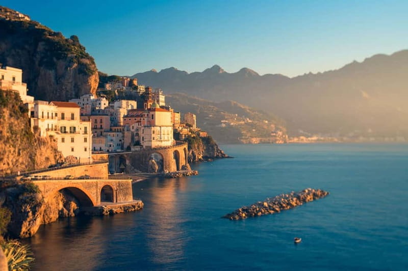 Amalfi: Sunset Boat Tour with Fruit and Drinks - Praiano’s Swimming Break as the Sky Turns Gold