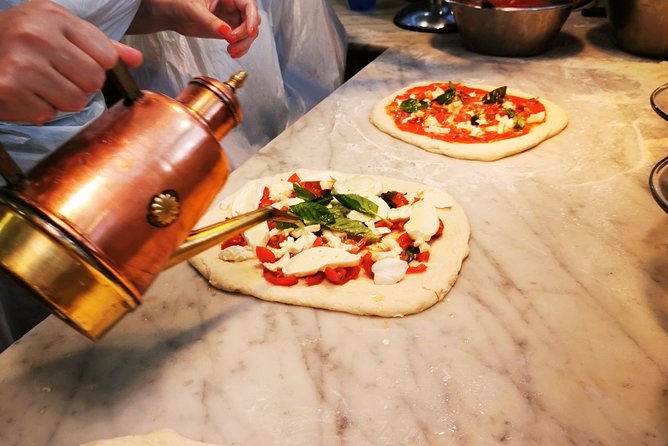 Authentic Pizza Making Class in Naples with Appetizers and Drink - Stretching and baking your pizza: Margherita time