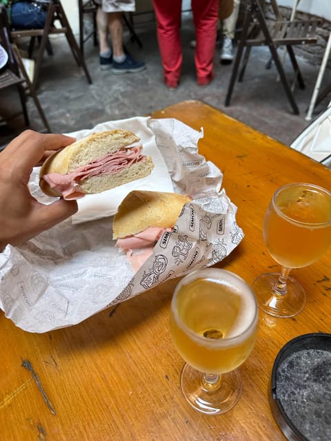 Bologna: Walking Food Tour and Highlights with a Local Guide - Via Drapperie: A Perfect Stretch Before the First Real Bites