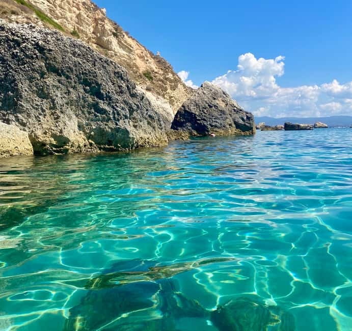Cagliari: Boat Tour with Snorkeling, GoPro & Sardinian Beer - Cagliari coastline, but with real swim time