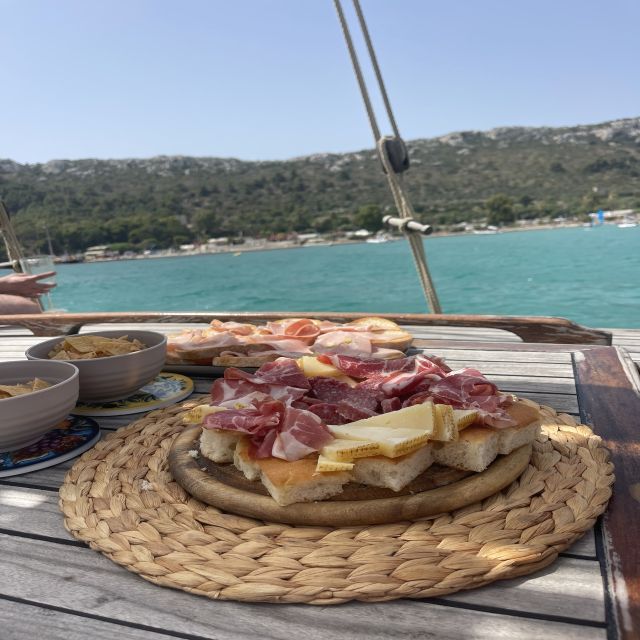 Cagliari: Boat Tour with Swim Stops, Snorkeling, & Aperitif - From Marina Piccola to the Devil’s Saddle, by Wooden Boat