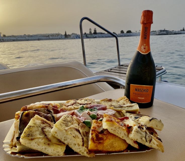 Cagliari: Sunset Boat Tour with Aperitif and Prosecco - Sella del Diavolo swim and snorkeling stop: where the water time pays off