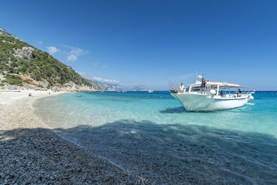 Cala Gonone: Gulf of Orosei Cruise with Food and Swimming - Guide, Audio Guide, and Language Reality on the Deck