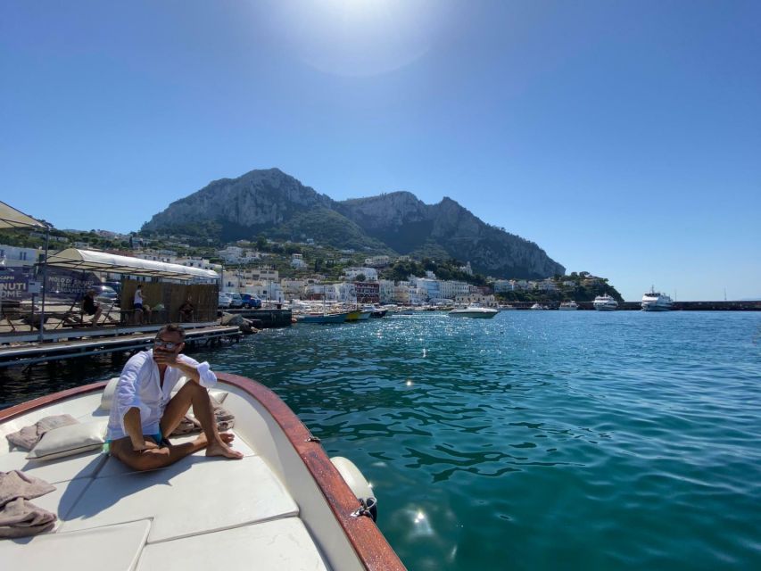 Capri: Island and Grottos Boat Cruise with Snacks and Drinks - Limoncello, snacks, and drinks on board: the simple pleasure part