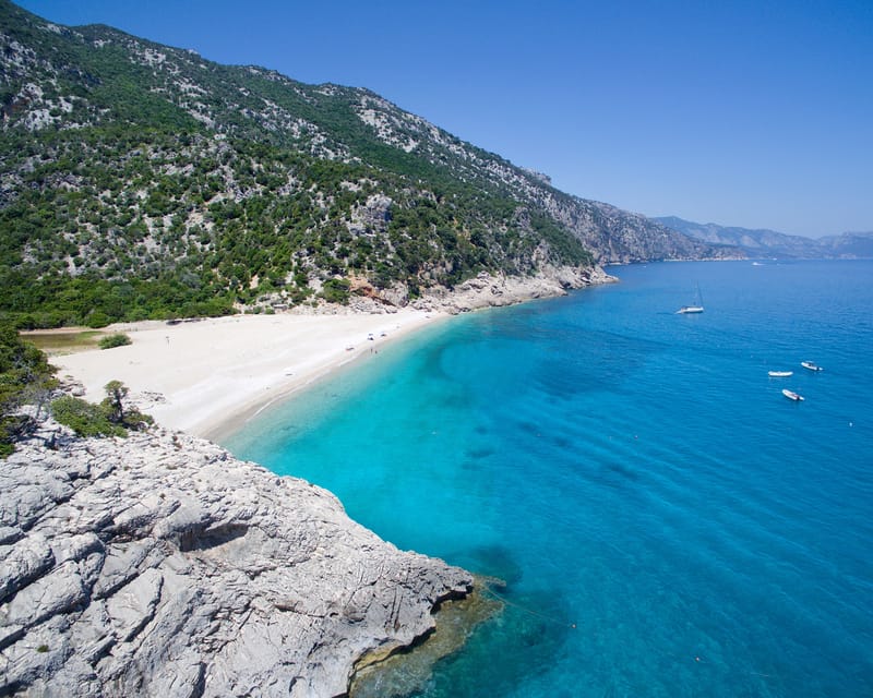 From Arbatax: Full-Day Guided Boat Tour of the Baunei Coast - Natural Park views, 21 natural monuments, and the coastal drive-by magic