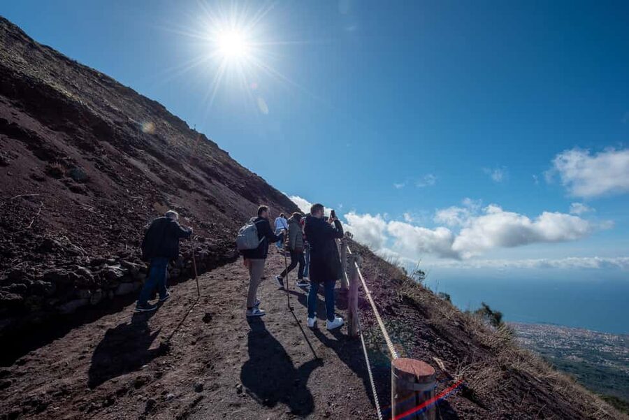 From Naples: Pompeii and Vesuvius Guided Day Trip with Lunch - Walking up Mount Vesuvius, aiming for the crater and the Gulf of Naples views