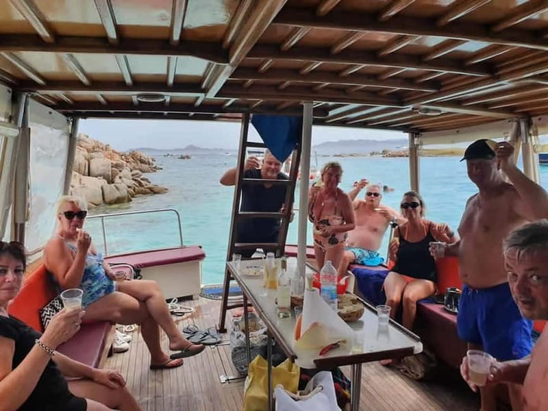 From Palau: La Maddalena Cruise with Lunch & Drinks - Stop 1: Cala Soraya and Cala Granara style swimming, not the crowded chaos