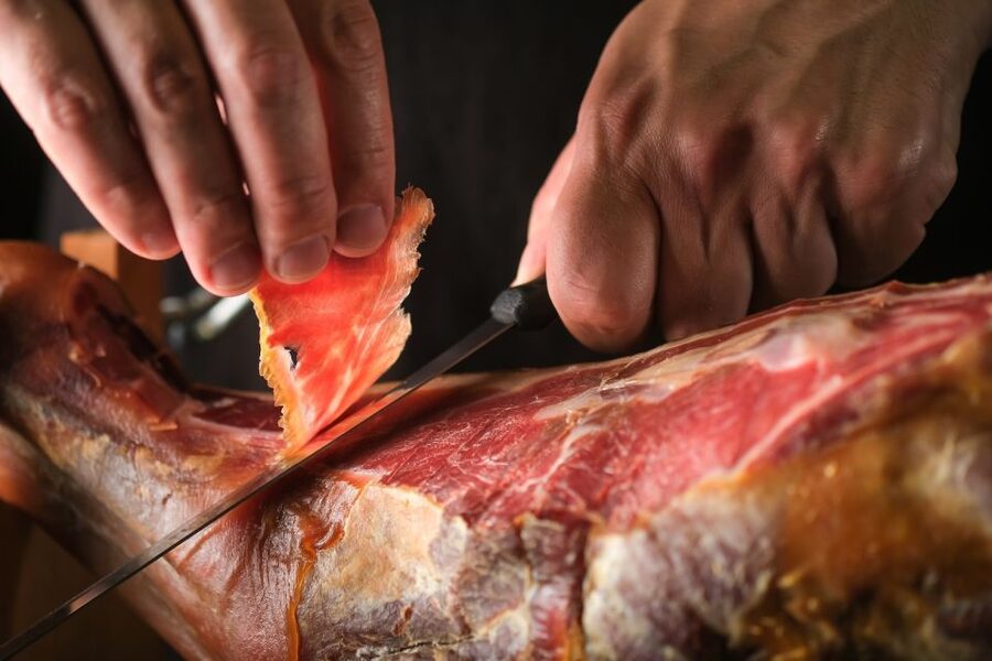 From Parma: Parmigiano and Parma Ham Guided Food Tour - Parma Ham at a farmhouse-style factory, where curing is the main event