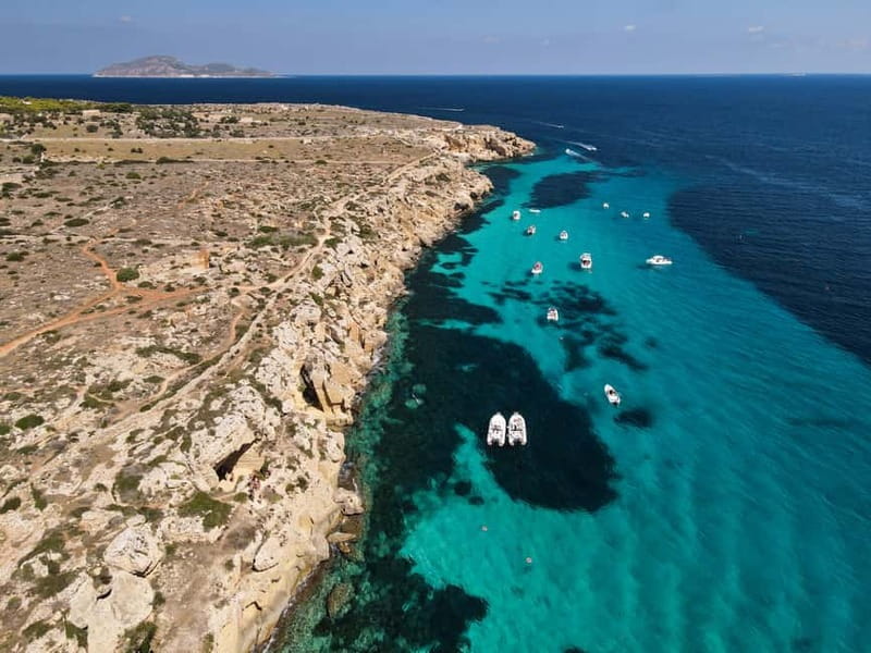From Trapani: Egadi Islands Favignana & Levanzo Cruise - Drinks, snacks, and the music factor that makes the day feel lighter