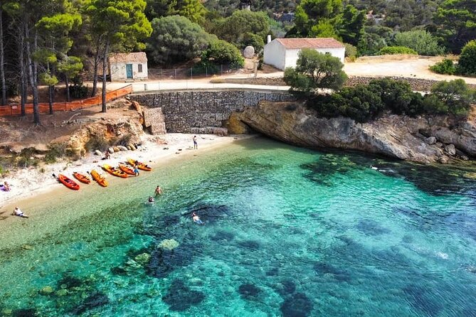 Kayak tour with aperitif and dolphins - From Baracconi to Cala Moresca, the sea does the selling