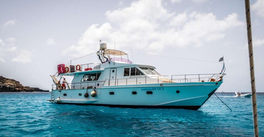 Lampedusa: Yacht excursion, swimming stops and typical lunch - Lunch on board: fish pasta, caponata, and a table like a restaurant