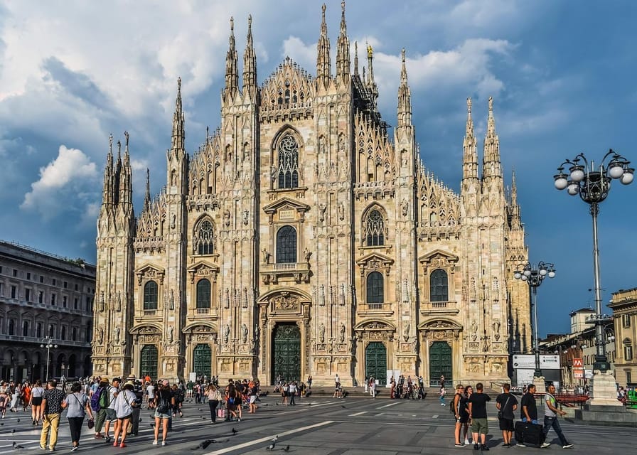 Milan: Cathedral and Terraces Guided Tour with Tickets - Inside Milan Cathedral: Gothic details, stained glass, and the symbols people remember