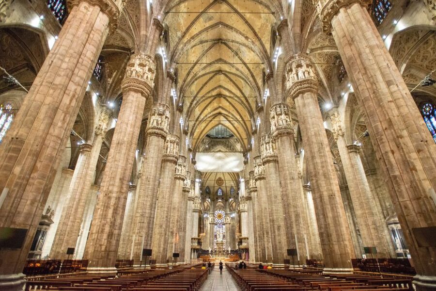 Milan: Fast-Track Milan Cathedral and Terraces Guided Tour - Entering the cathedral complex through the separate entrance