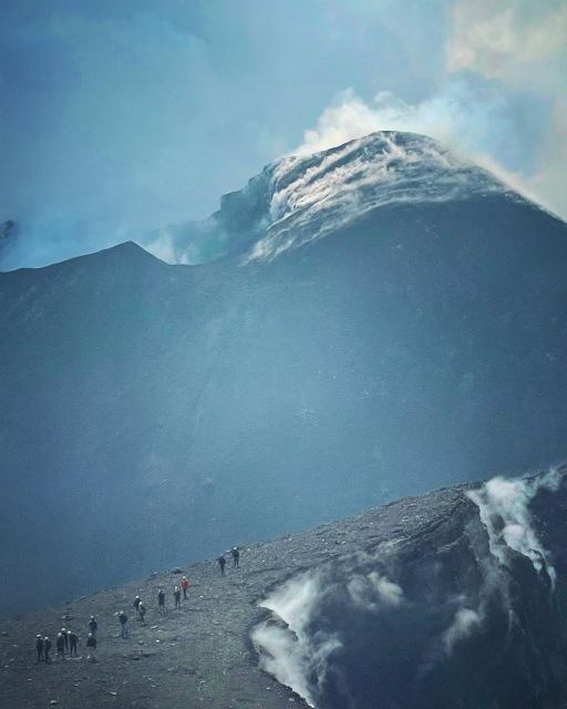 Mount Etna: Summit Crater Trek with Cable Car - The descent: volcanic sand, craters of the 2002 eruption, and the Valle del Bove amphitheater