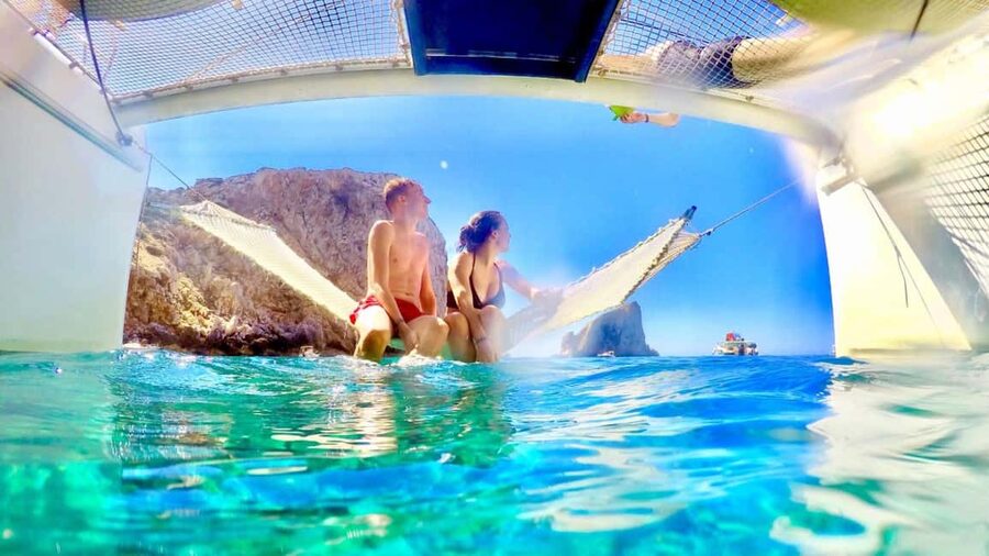 Porto Conte: Half-day catamaran tour with aperitif - Toni and the small-group style that makes the ride feel personal