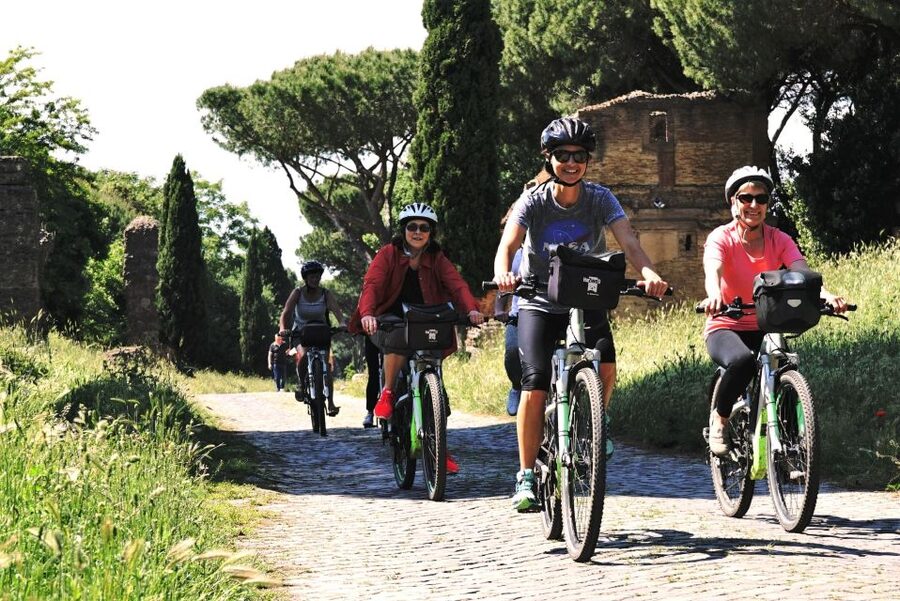 Rome: Appian Way, Catacombs, & Roman Aqueducts E-bike Tour - Parco degli Acquedotti: biking under the aqueduct arches