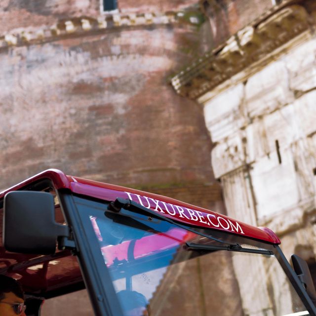 Rome: City Golf Cart at Night Tour - Colosseum at night: lit up, and often far calmer