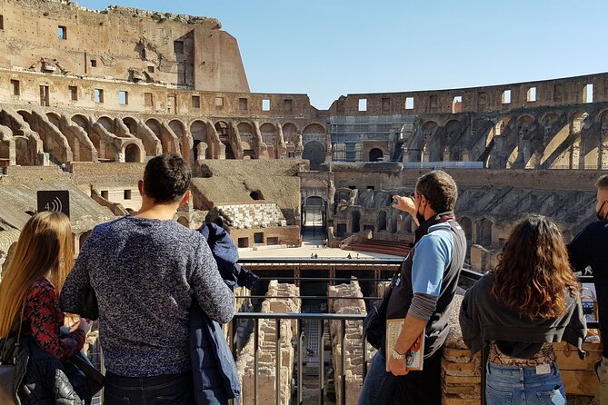 Rome: Colosseum, Palatine Hill and Roman Forum Guided Tour - Down into the Roman Forum valley: temples, doors, and the Vestals