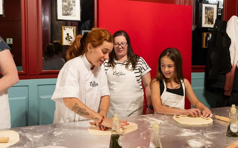Rome: Pizza and Tiramisù Cooking Class with Glass of Wine - Sit down to what you made: wine, limoncello, and dessert