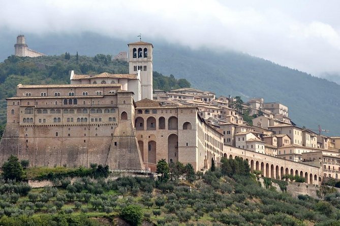 Small Group Tour of Assisi and St. Francis Basilica - Piazza del Comune and Minerva’s Temple, Roman stone inside medieval power