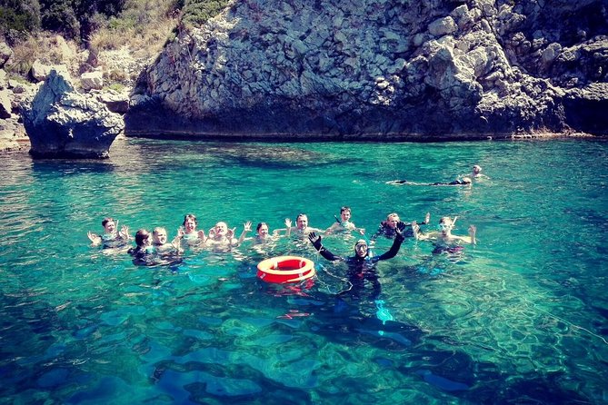 Snorkeling Tour Coast to Coast Taormina and Isola Bella - Cruise the Taormina coast, with Etna in the distance