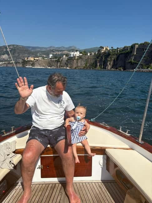 Sorrento: Boat Coastal Cruise with Swim and Limoncello - From Marina Grande to the waterline: what boarding is like