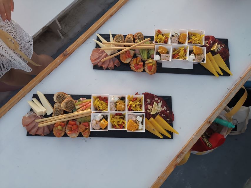 Syracuse: Ortigia Sunset Cruise with Aperitif - The cave circuit: Capuchin cove, dolphin rock, and coral grottoes