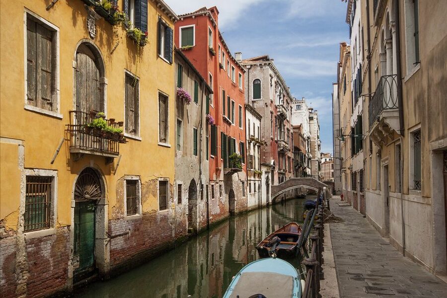Venice: Morning Walking Tour - Scuola Grande di San Marco, charity, and the Captains of Fortune